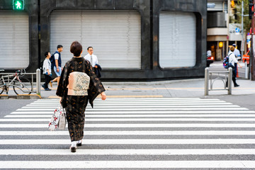 Japanese Woman is Crossing Road Wearing Japanese Traditional Dress Kimono.
