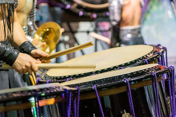 Fototapeta na wymiar Closeup View Of Man's Hands, Drums and Drumsticks.