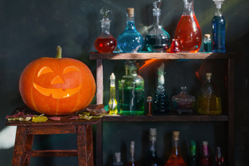 Halloween decoration with pumpkins and magic potions indoor