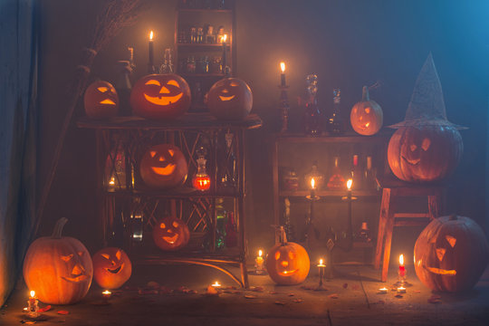 Halloween decoration with pumpkins and magic potions indoor