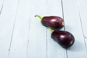 eggplants on shabby chic bright wood table