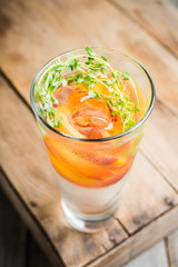 Gin based cocktail with peaches and thyme. Selective focus. Shallow depth of field.