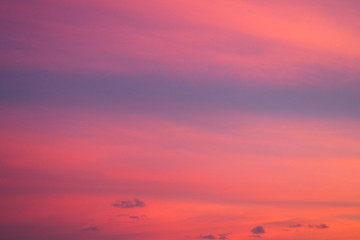 Beautiful view of warm sunset sky in dark pink red and purple tone for sweet and colorful background and wallpaper