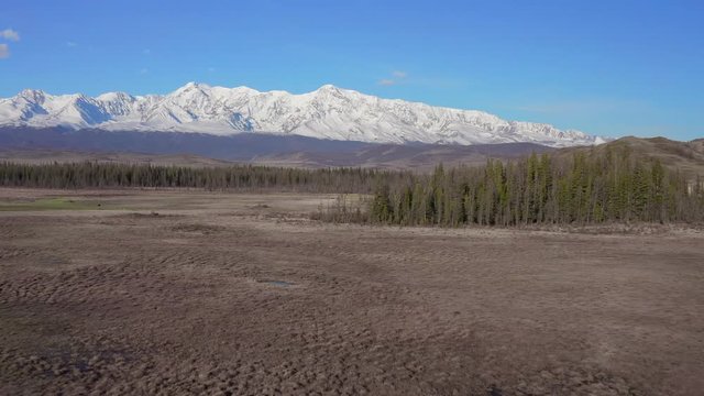 Mountain peaks, blue sky, bird, envirement. Shooting with drone 4K.
