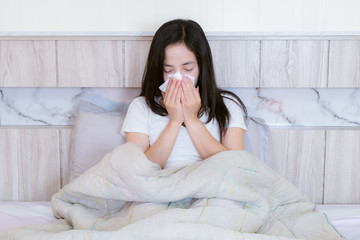 Flu medicine woman Infected With Cold the drug is placed on the table and a glass of water.