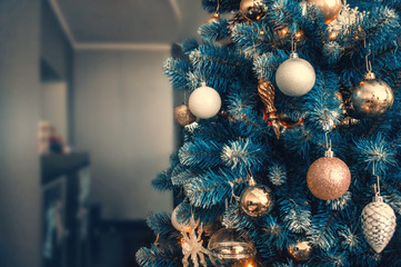 Teal orange Christmas background with decorated tree toys. Celebrate on the Christmas tree with colorful balloons decorations. Defocused. Blur