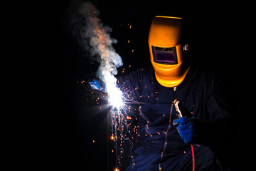 welding with workpiece steel. Working welder steel Using electric welding machine safety equipment...