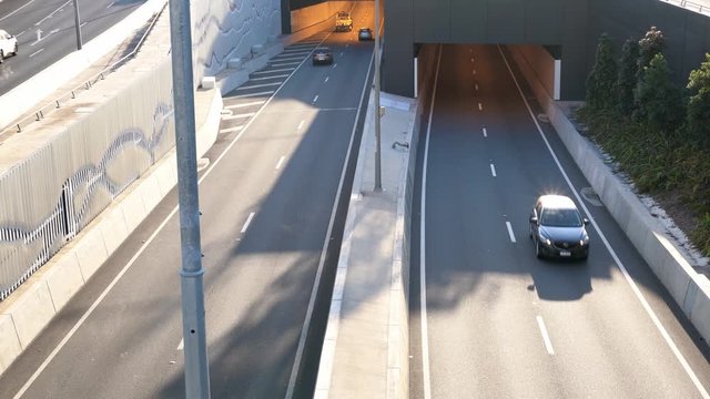 Traffic entering and exiting motorway tunnel