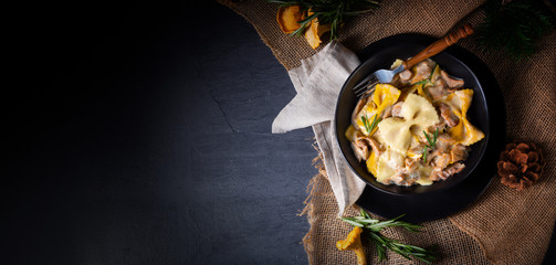 Colorful farfalle pasta with chanterelles and cream sauce. - obrazy, fototapety, plakaty