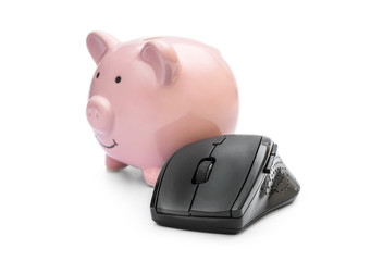 Computer mouse with piggy bank on white.