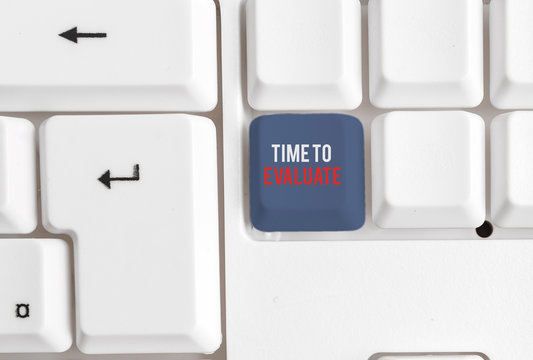 Writing note showing Time To Evaluate. Business concept for judge something with respect to its worth or significance White pc keyboard with note paper above the white background