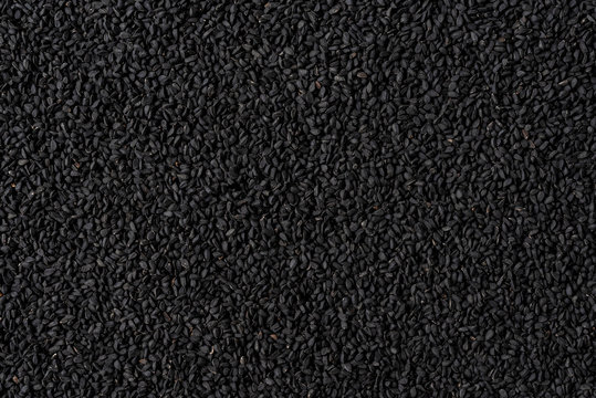 Black cumin texture. Background with copyspace. Close up. Top view