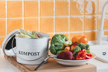 trash bin for composting with leftover in the kitchen