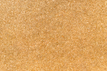 Texture from a corkwood background in brown-yellow color, close up shot.