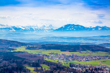 Panorama of alps and towns Wettswil, Stallikon and Bonstetten from odservation tower on Uetliberg mountain