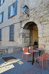 Tables and chairs of a street cafe in the old part of town