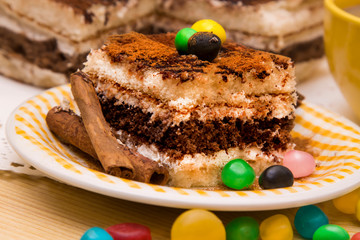 Tiramisu dish with cinnamon and candies