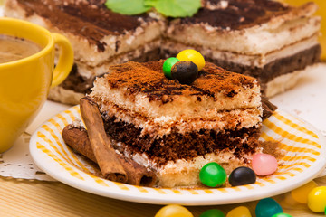 Tiramisu dish with cinnamon and candies