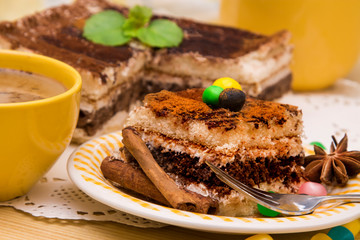 Tiramisu dish with cinnamon and candies