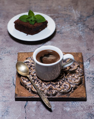 Slices brownies chocolate cake and cup espresso coffee. delicious breakfast