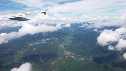 Plane flying over Northern Thailand mountain forest flight to Chiang Mai