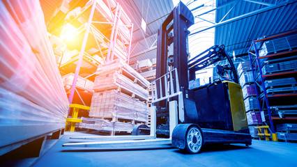 Forklift loader in storage warehouse ship yard. Distribution products. Delivery. Logistics. Transportation. © romaset