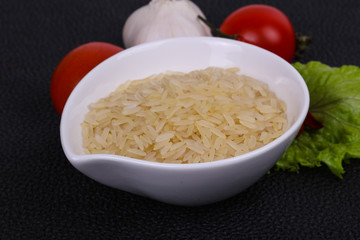 Raw uncooked rice in the bowl