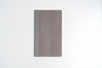 gray notebook isolated on white background.top view