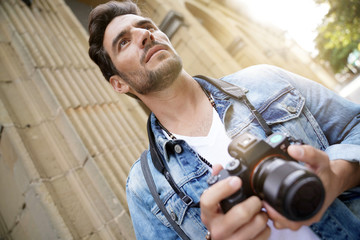Photographer taking pictures in European city