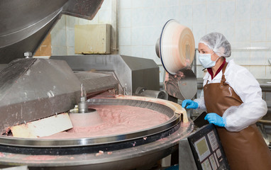 Female controlling making of meat batter