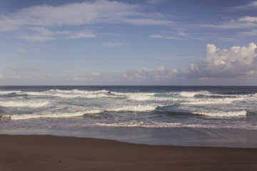beautiful blue ocean and black sand beach on the Azores, in Portugal