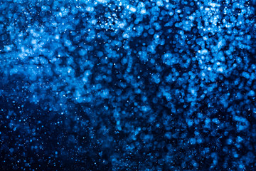 Abstract Blue bokeh defocus glitter blur background.