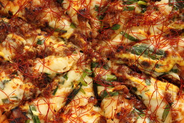 Fusion pizza, beef and leek with chili pepper  Asian taste