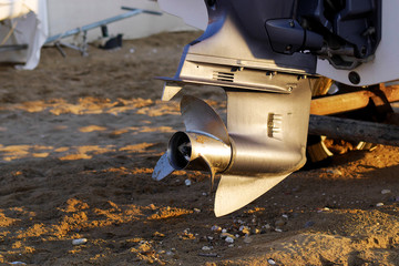 closeup of outboard motor's lower unit with propeller
