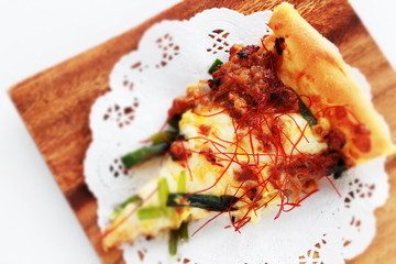 Fusion pizza, beef and leek with chili pepper  Asian taste