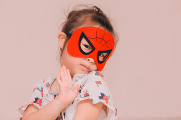 Children girl with the mask in halloween day
