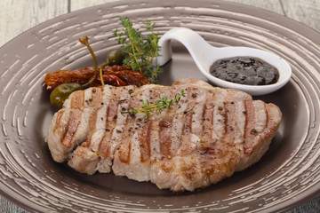 Grilled pork steak with pepper sauce