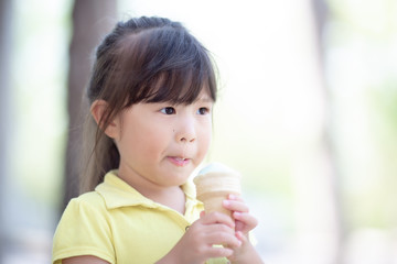 Asian little girl eating icecream