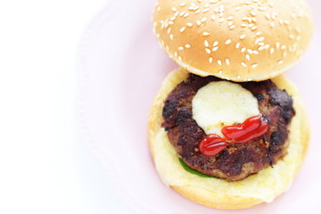Homemade patty burger on dish for comfort food image