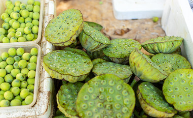 Green lotus. Unripe lotus flower. Lotus seeds. Edible exotic flower sold on a street in Beijing.