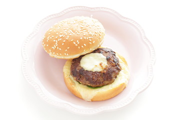 Homemade patty burger on dish for comfort food image