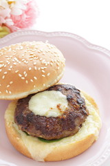 Homemade patty burger on dish for comfort food image