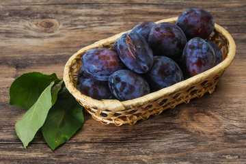 Ripe plum heap in the basket