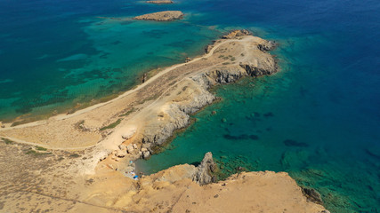 Fototapeta na wymiar Aerial drone photo of emerald secluded crystal clear sea rocky cove of Ble limanaki or Blue Harbour in famous island of Astypalaia, Dodecanese, Greece