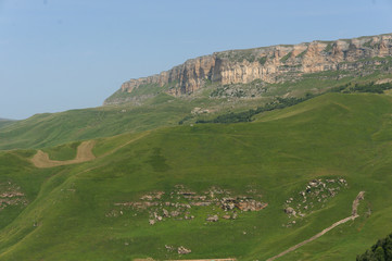 Lush green lawns meadows and mountains above 2000 m on the gumbashi pass in the northern caucasus...