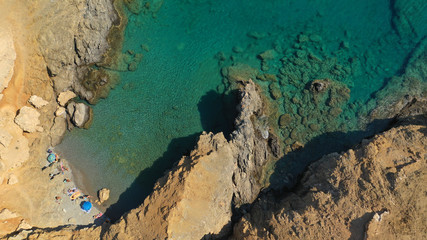 Aerial drone photo of emerald secluded crystal clear sea rocky cove of Ble limanaki or Blue Harbour in famous island of Astypalaia, Dodecanese, Greece