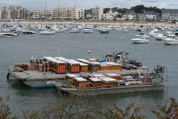 Preparation of fireworks on a barge at sea in a port in Brittany, France