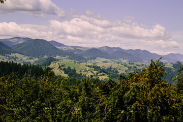 Fototapeta premium Mountain village landscape in the wild Ukrainian Bukovyna area