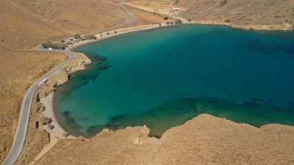 Aerial drone photo of famous calm turquoise sea sandy beaches of Steno next to small chapel of Agios Mamas, Astypalaia island, Dodecanese, Greece
