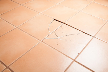 Broken, tenting, missing, cracked, floor tiles